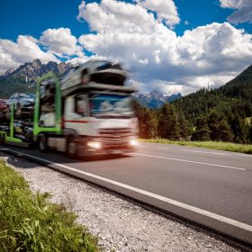 truck-trailer-transports-new-cars-rides-on-highway-2026-03-24-04-54-03-utc (1)